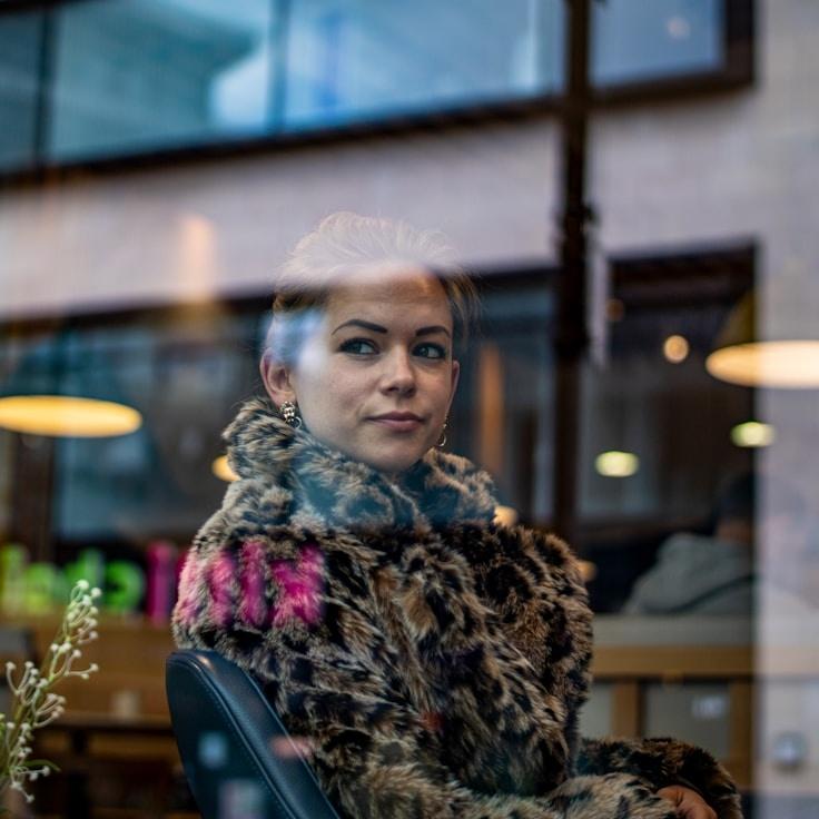 Liam Chen, Client Relations Director, discussing corporate gifting strategy with business clients